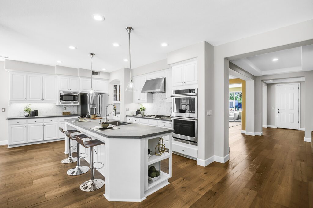 View of the modern kitchen room with white cabinets